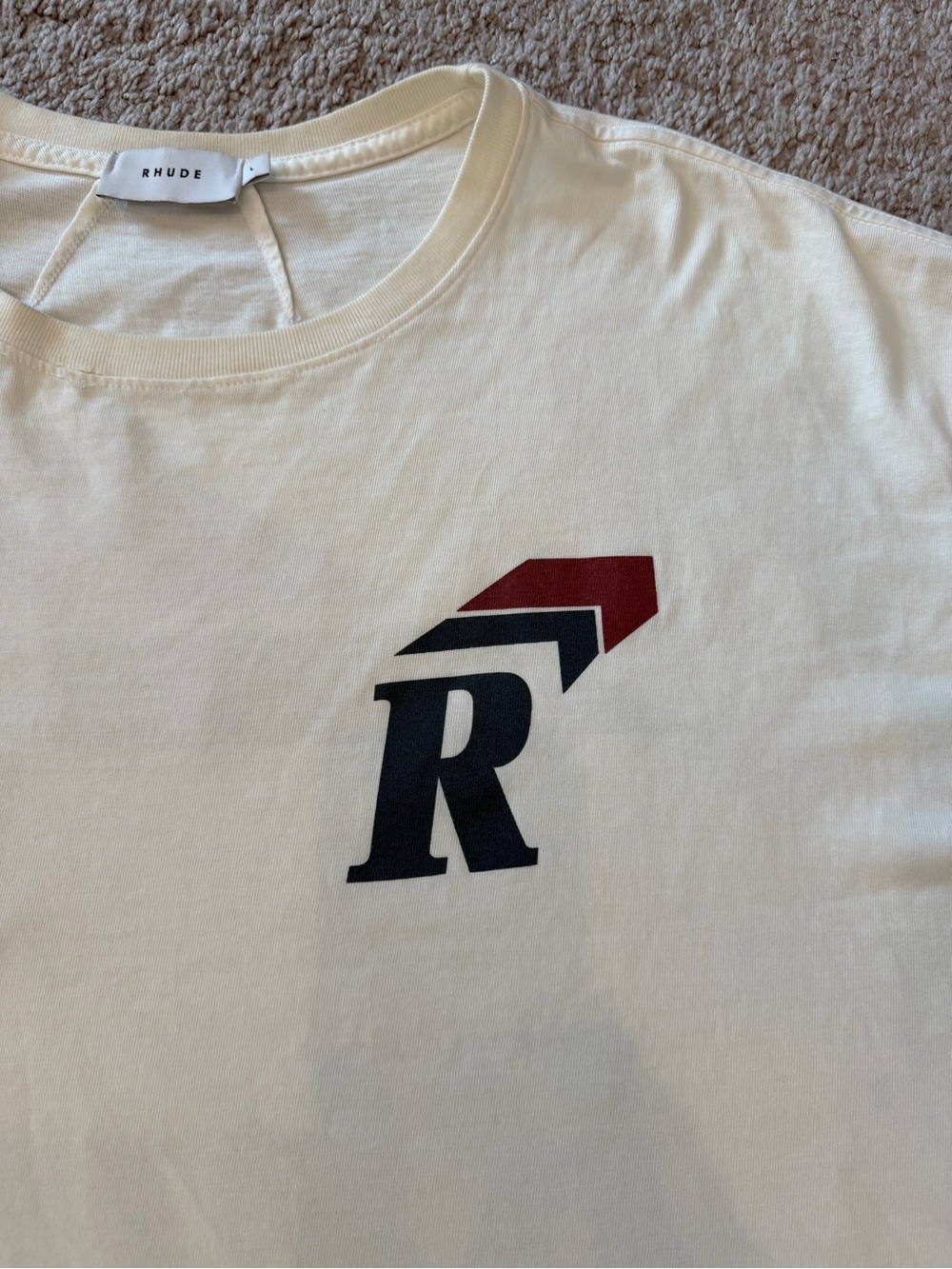 Rhude Cream Short Sleeve Tee with Black Logo Tag